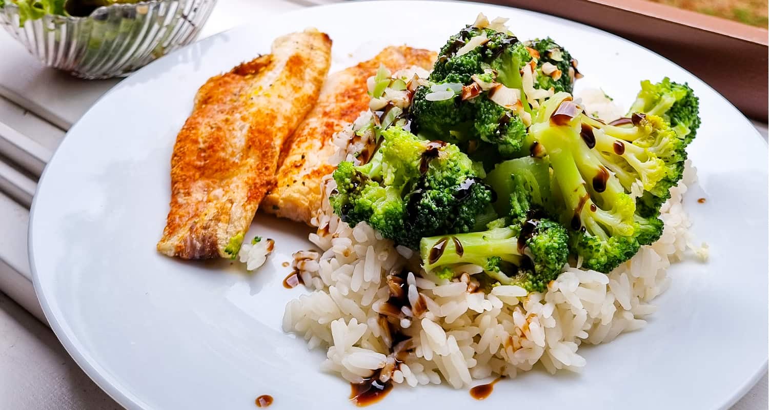 plate with fish, rice, and vegetables